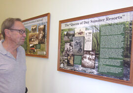 George Fluer reviewing the interpretive panels