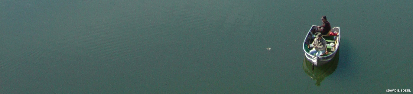 stark ariel photo of a boat with two fisherman